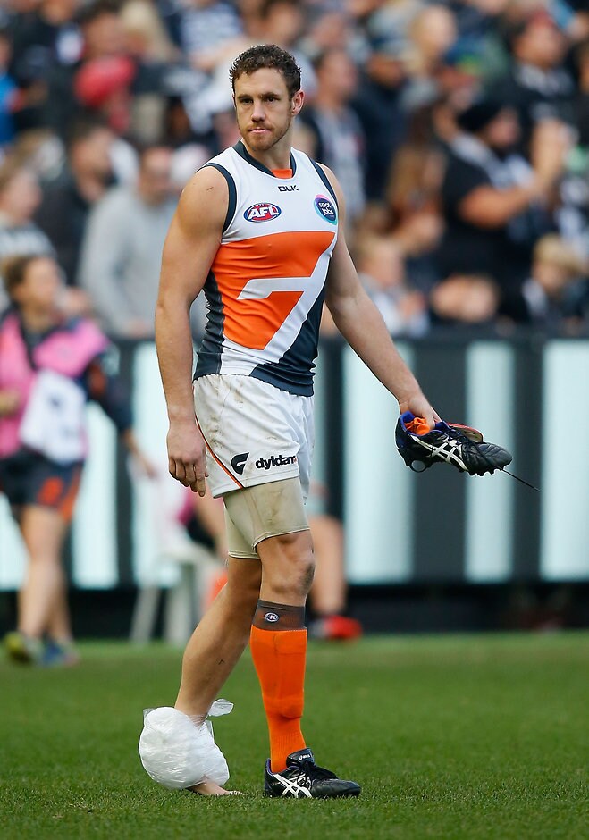AFL 2015 Rd 11 - Collingwood v GWS Giants MELBOURNE, AUSTRALIA - JUNE 14: Shane Mumford of the Giants leaves the ground injured after losing the 2015 AFL round eleven match between the Collingwood Magpies and the GWS Giants at the Melbourne Cricket Ground, Melbourne on June 14, 2015. (Photo by Sean Garnsworthy/AFL Media)